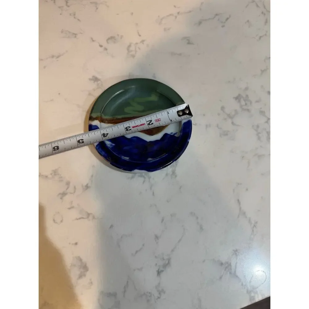 handcrafted ceramic spoon rest mountain green foreground blue sky signed